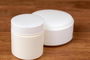 The beautiful mockup showcases good cosmetic packaging for cream containers, emphasizing future cosmetic innovations. photo