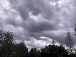 Thunderclouds before rain in the village photo