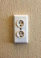 an electrical outlet on a wall with two outlets photo