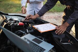 car service center mechanics are checking condition car and engine make sure they are ready use and in perfect condition according center warranty. periodic vehicle inspections for safety in driving. photo