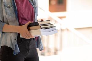 The young woman held a Bible in her hand and tried to learn and understand God teachings from the Bible she held. Concepts of belief and the power of faith in God and teachings from the Bible. photo