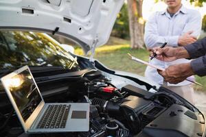 Technicians from service center inspect and assist customers cars that are having problems while traveling build confidence in customers who choose buy car from service center and receive help quickly photo