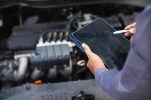car service center mechanics are checking condition car and engine make sure they are ready use and in perfect condition according center warranty. periodic vehicle inspections for safety in driving. photo