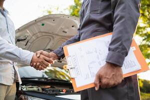 Technicians from service center inspect and assist customers cars that are having problems while traveling build confidence in customers who choose buy car from service center and receive help quickly photo