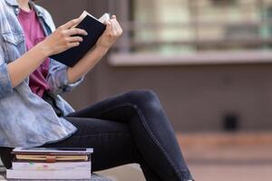 The young woman held a Bible in her hand and tried to learn and understand God teachings from the Bible she held. Concepts of belief and the power of faith in God and teachings from the Bible. photo