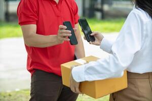 SME business operator is inspecting and packing products into parcel box for delivery company that will come pick up products after participating in online marketing with Application shopping online photo