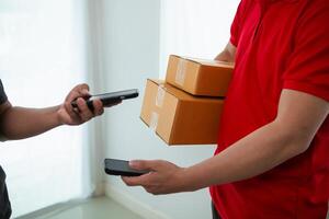 SME business operator is inspecting and packing products into parcel box for delivery company that will come pick up products after participating in online marketing with Application shopping online photo