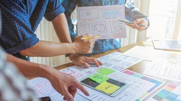 mobile application development team is studying and designing ux ui system to display and color in application on smartphone to work efficiently and not cause the ux ui system to have any errors. photo