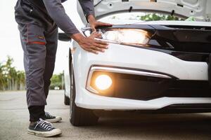 Technicians from service center inspect and assist customers cars that are having problems while traveling build confidence in customers who choose buy car from service center and receive help quickly photo