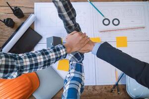 team of engineers and designers has come together to design an energy saving home or green energy home that uses natural energy such as wind turbines and solar cells to generate electricity for home. photo