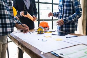 team of engineers and designers has come together to design an energy saving home or green energy home that uses natural energy such as wind turbines and solar cells to generate electricity for home. photo