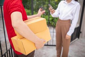 SME business operator is inspecting and packing products into parcel box for delivery company that will come pick up products after participating in online marketing with Application shopping online photo