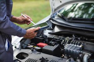 car service center mechanics are checking condition car and engine make sure they are ready use and in perfect condition according center warranty. periodic vehicle inspections for safety in driving. photo