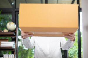 SME business operator is inspecting and packing products into parcel box for delivery company that will come pick up products after participating in online marketing with Application shopping online photo