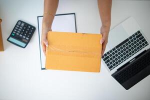 SME entrepreneurs prepare packages and verify customer information deliver products according orders. Concepts of selling online and doing online marketing with reliable system of shopping online photo