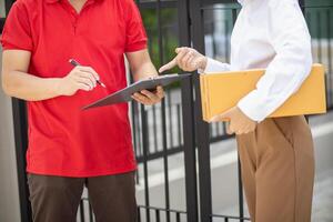 SME business operator is inspecting and packing products into parcel box for delivery company that will come pick up products after participating in online marketing with Application shopping online photo