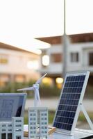team of engineers and designers has come together to design an energy saving home or green energy home that uses natural energy such as wind turbines and solar cells to generate electricity for home. photo