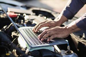 car service center mechanics are checking condition car and engine make sure they are ready use and in perfect condition according center warranty. periodic vehicle inspections for safety in driving. photo