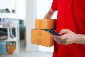 SME business operator is inspecting and packing products into parcel box for delivery company that will come pick up products after participating in online marketing with Application shopping online photo