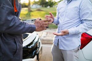 Technicians from service center inspect and assist customers cars that are having problems while traveling build confidence in customers who choose buy car from service center and receive help quickly photo