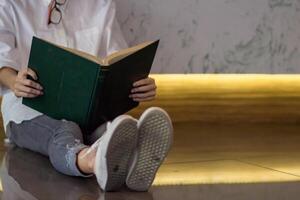 The young woman held a Bible in her hand and tried to learn and understand God teachings from the Bible she held. Concepts of belief and the power of faith in God and teachings from the Bible. photo