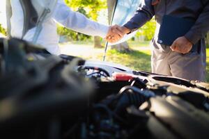Technicians from service center inspect and assist customers cars that are having problems while traveling build confidence in customers who choose buy car from service center and receive help quickly photo