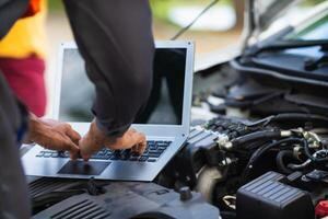 car service center mechanics are checking condition car and engine make sure they are ready use and in perfect condition according center warranty. periodic vehicle inspections for safety in driving. photo