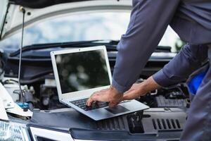 car service center mechanics are checking condition car and engine make sure they are ready use and in perfect condition according center warranty. periodic vehicle inspections for safety in driving. photo