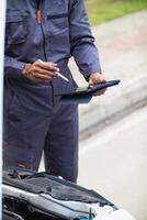 car service center mechanics are checking condition car and engine make sure they are ready use and in perfect condition according center warranty. periodic vehicle inspections for safety in driving. photo