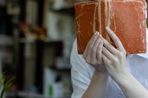 The young woman held a Bible in her hand and tried to learn and understand God teachings from the Bible she held. Concepts of belief and the power of faith in God and teachings from the Bible. photo