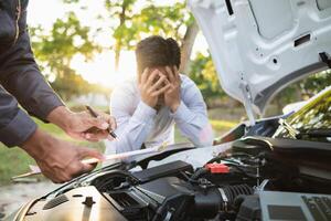 Technicians from service center inspect and assist customers cars that are having problems while traveling build confidence in customers who choose buy car from service center and receive help quickly photo