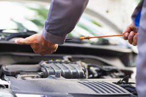 car service center mechanics are checking condition car and engine make sure they are ready use and in perfect condition according center warranty. periodic vehicle inspections for safety in driving. photo