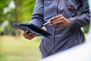 Technicians from service center inspect and assist customers cars that are having problems while traveling build confidence in customers who choose buy car from service center and receive help quickly photo