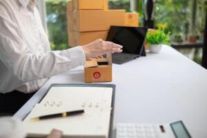 SME entrepreneurs prepare packages and verify customer information deliver products according orders. Concepts of selling online and doing online marketing with reliable system of shopping online photo