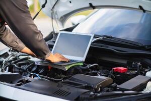 car service center mechanics are checking condition car and engine make sure they are ready use and in perfect condition according center warranty. periodic vehicle inspections for safety in driving. photo