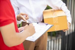 SME business operator is inspecting and packing products into parcel box for delivery company that will come pick up products after participating in online marketing with Application shopping online photo