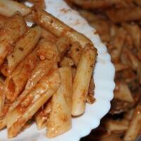 Pasta is a collective name for a category of food made from wheat flour and water, sometimes with egg. photo