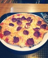 Pizza is an Italian food that was created in Italy The Naples area. It is made with different toppings. photo
