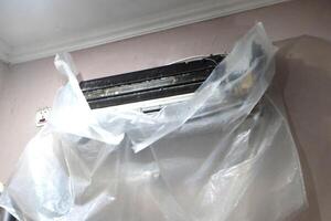 The AC unit is being cleaned photo