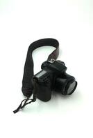 Black digital SLR camera in a white background photo
