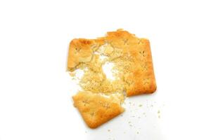 crushed malkist crackers on a white background photo