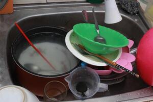 the sink is full of dirty dishesthe sink is full of dirty dishes photo