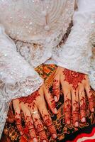 the bride wearing innai in her hand photo