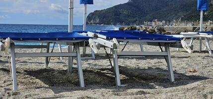 Spotorno, Ligurian Riviera in summer. A bathing establishment is a tourist facility located near a beach, equipped with rooms and equipment that offer services and hospitality to bathers for bathing. photo