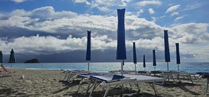 Spotorno, Ligurian Riviera in summer. A bathing establishment is a tourist facility located near a beach, equipped with rooms and equipment that offer services and hospitality to bathers for bathing. photo