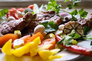 Club Beef steak with pepper sauce and Grilled vegetables on cutting board on dark wooden background photo