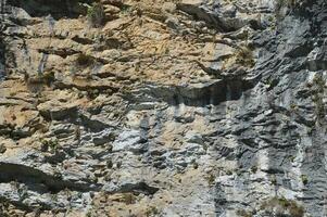 Fragment of a mountain, rocks, stone texture, natural background. photo