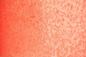 Abstract background. Blurred image of orange soft gradients and highlights and texture of water drops. photo