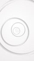 vertical - elegante limpar \ limpo branco abstrato tecnologia fundo com suavemente rotativo círculo formas. isto à moda minimalista geométrico fundo é cheio hd e uma desatado laço. video