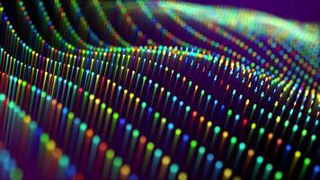 Multicolor wave flow animation of smoothly moving colorful particles on a dark background. Digital wallpaper with abstract field of rainbow colored dots and lines. Motion graphics , 4k , 30 fps video